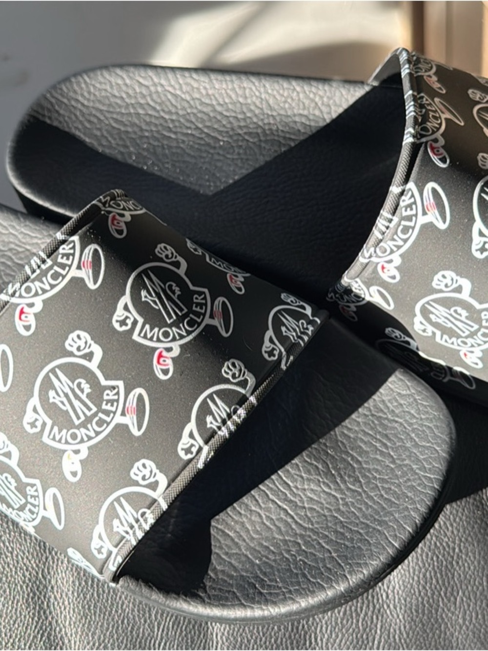 Moncler Black Slides with White Logo Print and Small Red Accents
